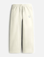 Beige sweatpants on a light gray background